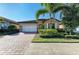 Charming single-Gathering house with a well-kept lawn and beautiful landscaping at 167 Maraviya Blvd, Nokomis, FL 34275