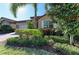 Landscaped front yard featuring beautiful plants and stone accents at 167 Maraviya Blvd, Nokomis, FL 34275