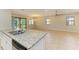 Open kitchen features stainless steel appliances, granite countertops, and an eat in area at 167 Maraviya Blvd, Nokomis, FL 34275
