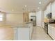 Bright kitchen features stainless steel appliances, gray backsplash, granite countertops, and eat in area at 167 Maraviya Blvd, Nokomis, FL 34275