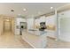 Bright kitchen features stainless steel appliances, gray backsplash, and granite countertops at 167 Maraviya Blvd, Nokomis, FL 34275