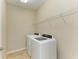 Bright laundry room with washer and dryer at 167 Maraviya Blvd, Nokomis, FL 34275