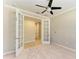 Bright home office with french doors and a ceiling fan at 167 Maraviya Blvd, Nokomis, FL 34275