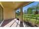 Brick patio with screen and view of backyard at 167 Maraviya Blvd, Nokomis, FL 34275