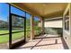 Brick patio with screen and view of backyard at 167 Maraviya Blvd, Nokomis, FL 34275