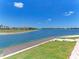 Scenic waterfront view with a private dock and lush green landscape at 167 Maraviya Blvd, Nokomis, FL 34275