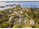 Aerial view of a marina community featuring boat docks, waterfront homes, and lush landscaping at 1680 Brookhouse Cir # 110, Sarasota, FL 34231