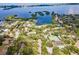Breathtaking aerial view of a lush community surrounded by serene waters and natural beauty at 1680 Brookhouse Cir # 110, Sarasota, FL 34231