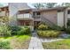 Inviting two-story townhome featuring a private entrance and lush landscaping at 1680 Brookhouse Cir # 110, Sarasota, FL 34231