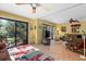 Spacious living room with large windows that fill the room with natural light at 1680 Brookhouse Cir # 110, Sarasota, FL 34231