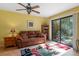 A bright and airy living room with large windows offering beautiful views of the outdoors at 1680 Brookhouse Cir # 110, Sarasota, FL 34231