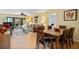 Inviting living room open to the dining area, featuring plenty of space and natural light at 1680 Brookhouse Cir # 110, Sarasota, FL 34231