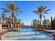 Inviting pool area featuring charming palm tree water fountains at 17217 Verona Pl, Lakewood Ranch, FL 34202