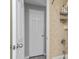 View of the bathroom entrance, showing the tiled shower with toiletry caddy and adjacent door at 1728 Bayonne St, Sarasota, FL 34231