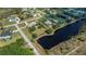 Residential area with houses, landscaping, a lake and mature trees at 2002 Palm View Rd, Sarasota, FL 34240