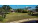 Aerial view of the home showcasing spacious lawns and a screened-in pool at 2002 Palm View Rd, Sarasota, FL 34240