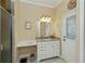 Bright bathroom featuring white vanity with granite countertop, neutral color scheme and tiled flooring at 2002 Palm View Rd, Sarasota, FL 34240