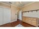 Another view of the bedroom with hardwood floors, closet and large dresser at 2002 Palm View Rd, Sarasota, FL 34240