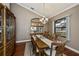 Formal dining room with wood table, decorative chandelier, and large windows at 2002 Palm View Rd, Sarasota, FL 34240