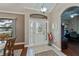 Inviting front foyer with a stylish tile floor, a decorative front door, and natural light at 2002 Palm View Rd, Sarasota, FL 34240
