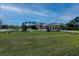 A lovely single story home boasting of a long driveway, mature trees and a large manicured lawn at 2002 Palm View Rd, Sarasota, FL 34240