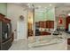 Bright kitchen with stainless steel appliances, ample cabinets, and granite countertops at 2002 Palm View Rd, Sarasota, FL 34240