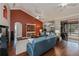 Cozy living room with wood floors, a vaulted ceiling, and views of the pool area at 2002 Palm View Rd, Sarasota, FL 34240