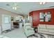Open floor plan with a modern color scheme, comfortable furniture and bar top seating at 2002 Palm View Rd, Sarasota, FL 34240