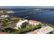 Aerial view showcases this waterfront condo, nearby marina and sparkling bay views at 210 3Rd W St # 8204, Bradenton, FL 34205