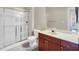 Bathroom features a glass-enclosed shower and modern vanity with storage at 210 3Rd W St # 8204, Bradenton, FL 34205