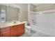 Bright bathroom showcasing a large vanity, toilet, and tub at 210 3Rd W St # 8204, Bradenton, FL 34205