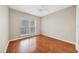 Bright bedroom with ceiling fan and gleaming hardwood floors at 210 3Rd W St # 8204, Bradenton, FL 34205