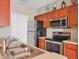 Bright kitchen features stainless steel appliances and wooden cabinetry at 210 3Rd W St # 8204, Bradenton, FL 34205