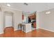 Cozy kitchen with bar seating, stainless steel appliances, and hardwood flooring at 210 3Rd W St # 8204, Bradenton, FL 34205