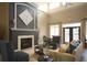 Elegant living room features a fireplace, comfortable seating, and sophisticated accents, ideal for relaxation at 210 3Rd W St # 8204, Bradenton, FL 34205