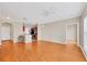 Open-concept layout highlighting the hardwood floors, ceiling fan, and combined living space at 210 3Rd W St # 8204, Bradenton, FL 34205