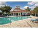 Large community pool featuring tiled deck, lounge chairs, and clubhouse at 210 3Rd W St # 8204, Bradenton, FL 34205