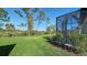 Lush backyard and lanai offer serene privacy and outdoor enjoyment at 217 Potenza Loop, North Venice, FL 34275