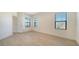 Bedroom with three windows and a closet at 217 Potenza Loop, North Venice, FL 34275