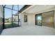 Screened patio with sliding glass doors lead to a spacious interior, enhancing indoor/outdoor living at 217 Potenza Loop, North Venice, FL 34275