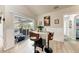 Dining area with barstool seating and a view to the outdoor pool and lanai at 221 Fairway Rd, Rotonda West, FL 33947