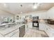 Well-equipped kitchen features stainless appliances, granite countertops, and seamless access to the living and dining areas at 221 Fairway Rd, Rotonda West, FL 33947