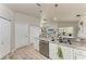 Well-equipped kitchen features stainless appliances, granite countertops, and seamless access to the living and dining areas at 221 Fairway Rd, Rotonda West, FL 33947