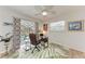 Bright office space featuring a ceiling fan, desk setup, and sliding glass doors to the pool area at 221 Fairway Rd, Rotonda West, FL 33947