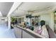Spacious outdoor patio with multiple seating areas, ceiling fans, and a relaxing atmosphere at 221 Fairway Rd, Rotonda West, FL 33947