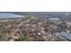 An aerial view of a mature tree lined neighborhood with a beautiful bay and shopping in the distance at 2300 23Rd S St, St Petersburg, FL 33712