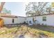 Charming backyard featuring a well-maintained lawn, stepping stones, and a cozy porch at 2300 23Rd S St, St Petersburg, FL 33712