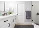 Stylish bathroom with white cabinets, quartz countertop, and a glass-enclosed shower at 2300 23Rd S St, St Petersburg, FL 33712