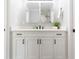 Modern bathroom vanity with double mirrors, sleek countertop, and stylish black hardware at 2300 23Rd S St, St Petersburg, FL 33712