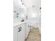 Bright bathroom featuring a new vanity with black hardware, quartz counters and a glass enclosed tub and shower at 2300 23Rd S St, St Petersburg, FL 33712